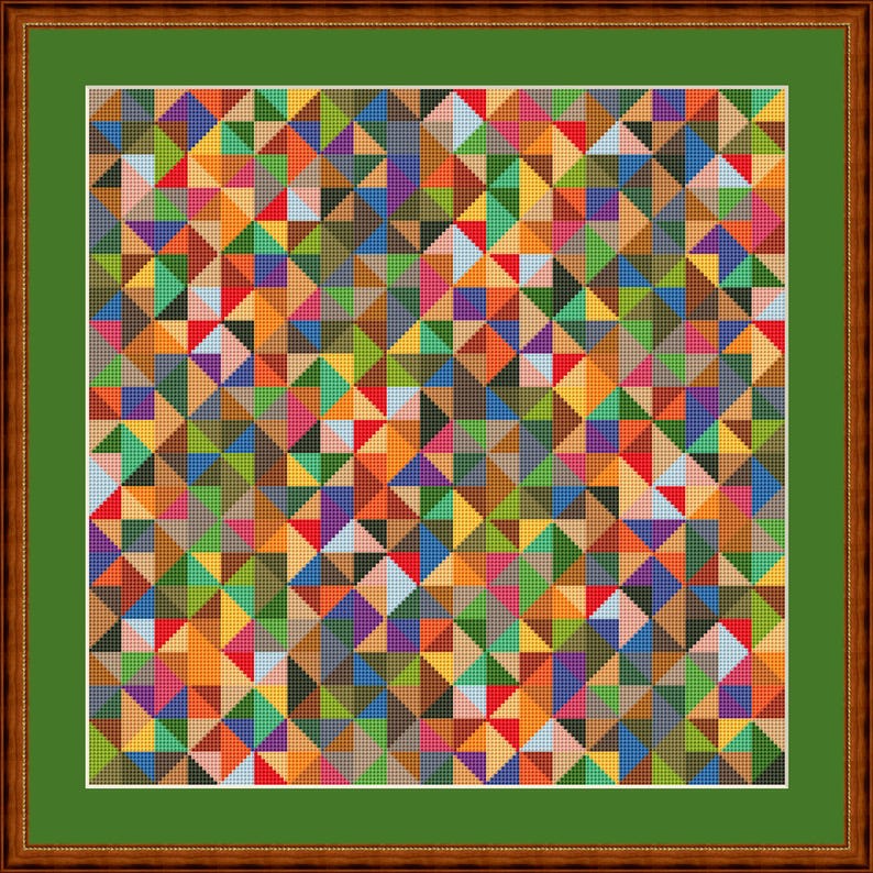 May include: A framed cross-stitch artwork with a geometric design of colourful triangles. The triangles are in shades of red, orange, yellow, green, blue, purple, and brown. The artwork is framed in a brown wooden frame with a green mount.