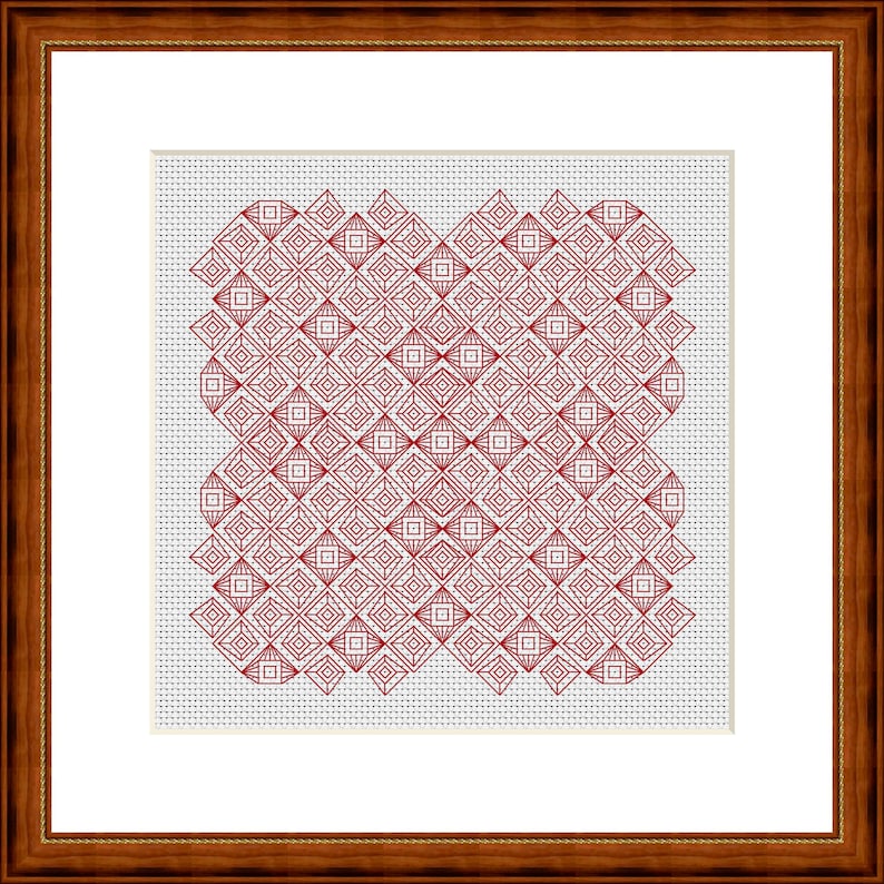 May include: A framed cross-stitch piece with a repeating red geometric pattern. The design features diamond and square shapes, forming a symmetrical and detailed texture. The artwork is set against a white background and enclosed in a dark brown wooden frame.