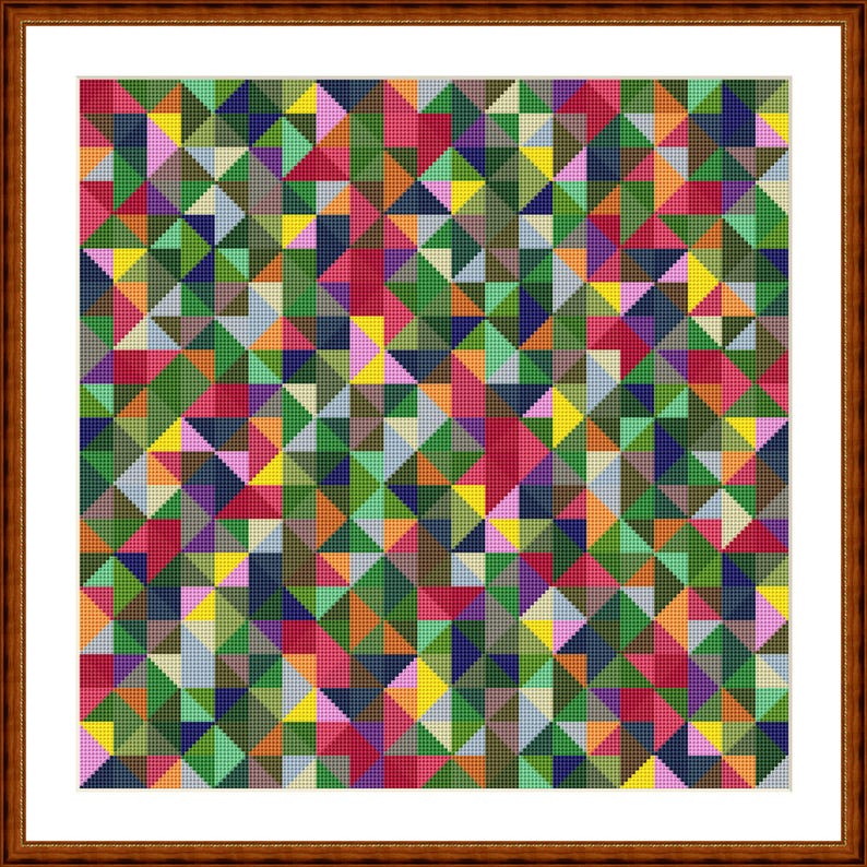 May include: A framed cross-stitch artwork with a geometric design of colourful triangles. The pattern uses shades of green, red, yellow, blue, and pink, forming a vibrant, abstract composition. The artwork is enclosed in a brown wooden frame.