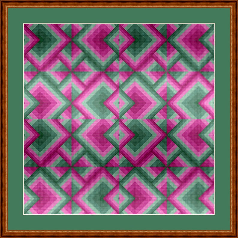 May include: A framed artwork featuring a geometric pattern in shades of pink, green, and gray. The design consists of layered diamond shapes, creating a 3D effect. The artwork is set against a green background and framed in a brown wooden frame.
