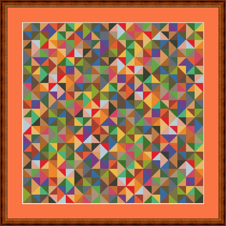 May include: A framed artwork with a vibrant geometric design. The pattern consists of many small triangles in various colours, such as red, blue, green, yellow, and purple. It is presented in a brown wooden frame with an orange mount.