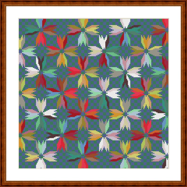 May include: A framed cross-stitch pattern featuring a repeating floral motif on a dark teal background. The design consists of interconnected four-petalled flowers in various colours including red, yellow, white, light green, and pink.