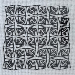 May include: A square piece of white Aida fabric featuring a black embroidered geometric pattern. The design consists of a repeating grid of squares, each containing intricate, radiating black thread lines that form a complex, interconnected motif.