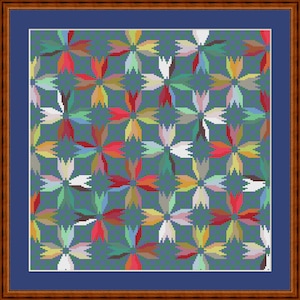 May include: A cross-stitch pattern featuring a repeating floral motif in shades of red, yellow, white, and green against a dark teal background. The design is enclosed within a blue mat and a brown wooden frame, creating a square wall art piece.