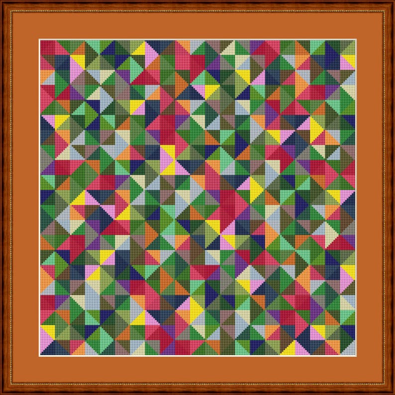 May include: A framed artwork with a geometric pattern made up of small triangles in various colours, including green, red, yellow, and blue. The artwork is enclosed in a brown wooden frame.