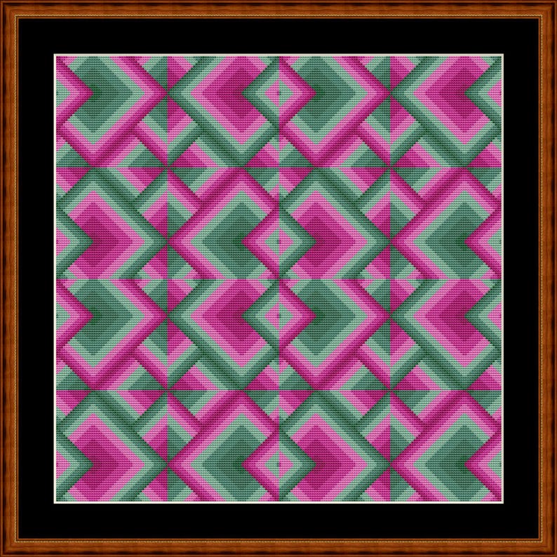 May include: A framed artwork featuring a geometric pattern. The design consists of layered diamond shapes in shades of green and pink, creating a three-dimensional effect. The artwork is encased in a dark brown wooden frame.