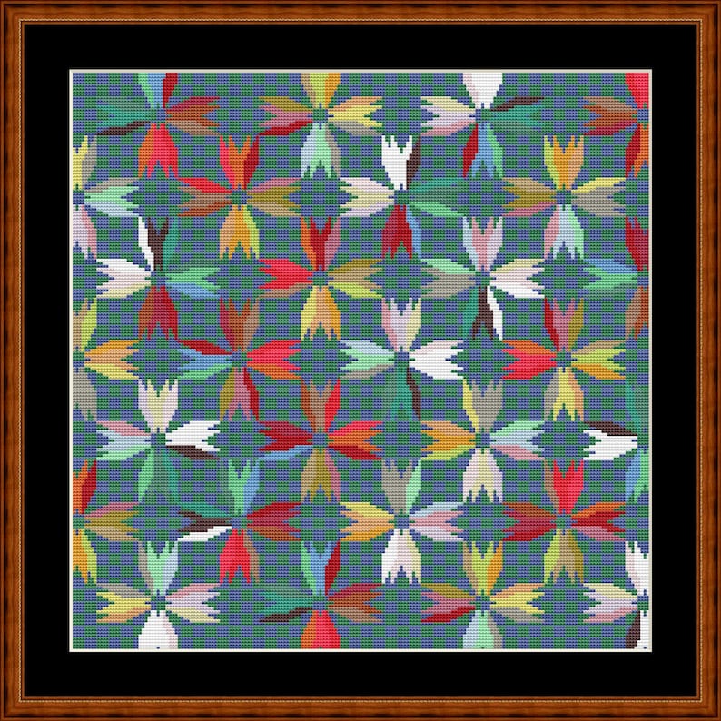 May include: A square cross-stitch embroidery featuring a repeating floral pattern of four-petaled blossoms in red, yellow, white, and green, set against a dark teal grid background, enclosed within a black mat and a polished brown wooden frame.