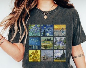 May include: A dark grey t-shirt featuring a collage of nine famous Vincent van Gogh paintings. The paintings include Starry Night, Sunflowers, and Wheatfield with Crows.