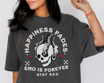 May include: A charcoal gray oversized t-shirt with a graphic print of a skull with flames and the text "Happiness Fades, Emo is Forever, Stay Sad".