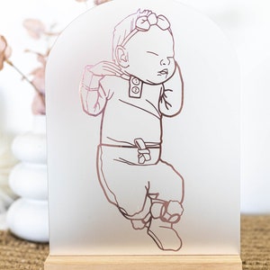 Evelet Designs Grand size acrylic perspex arch. Custom portrait of your baby illustrated and cut from your colour choice of vinyl. Pine or merbau base. You have the choice of colour for the background.

Frosted acrylic with rose gold mirror vinyl.