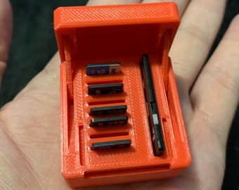 3D printed Flip Top Mini SD card holder.