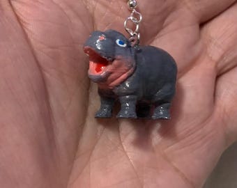3D printed Moo Deng earrings.