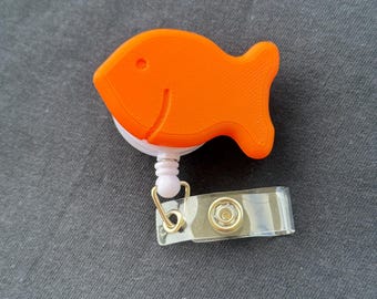 Gold fish snack cracker badge reel