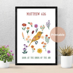 May include: A framed print with a yellow bird illustration and various flowers. The text "MATTHEW 6:26" is at the top, and "LOOK AT THE BIRDS OF THE AIR" is at the bottom. A "Printable" sticker is on the right side of the image.