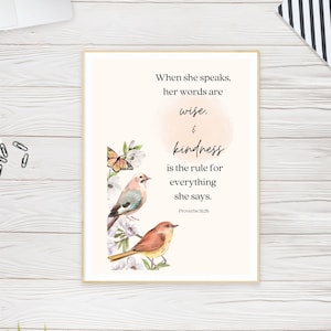 May include: A printable wall art design with a watercolor background and two birds perched on branches. The text reads "When she speaks, her words are wise, & kindness is the rule for everything she says. Proverbs 31:26"