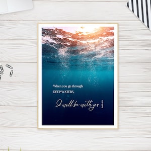 May include: A motivational quote about overcoming challenges, "When you go through deep waters, I will be with you."  The quote is set against a background of a blue ocean with sunlight shining through the water.