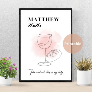 Può includere: Stampa d'arte stampabile con cornice nera, che presenta un disegno a linea di un bicchiere di vino e pane su uno sfondo acquerellato rosa. Il testo "Matteo 26:26 Prendete e mangiate; questo è il mio corpo." è incluso.