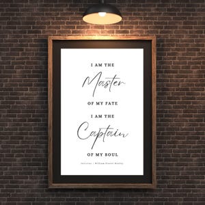 May include: A framed print with the quote "I am the Master of my Fate, I am the Captain of my Soul" in elegant script. The print is in a dark wooden frame, set against a brick wall.