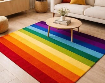 May include: A rectangular area rug featuring a vibrant rainbow pattern with wide, horizontal stripes in red, orange, yellow, lime green, forest green, light blue, royal blue, and deep purple, covering the floor in a bright, multi-colored design.