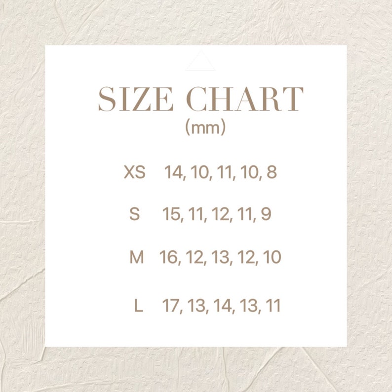 May include: A size chart for a product with measurements in millimeters. The chart lists sizes XS, S, M, and L with corresponding measurements for five different dimensions.