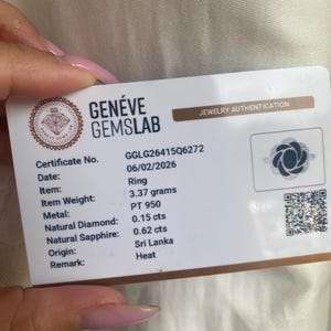 May include: A white Gen&eacute;ve Gemslab jewelry authentication card for a ring. The card lists certificate number GGLG26415Q6272, date 06/02/2026, weight 3.37 grams, PT 950 metal, 0.15 cts natural diamond, 0.62 cts natural sapphire, origin Sri Lanka, and heat.