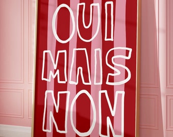 May include: A framed print with red and pink stripes and the text "OUI MAIS NON" in white. The print has a gold frame and a signature in the bottom right corner.