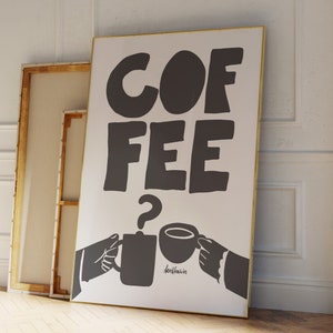 May include: A white poster with black text that reads "COFFEE?" with two cartoon hands holding coffee cups. The text "dontfreak.is" is written below the cups.