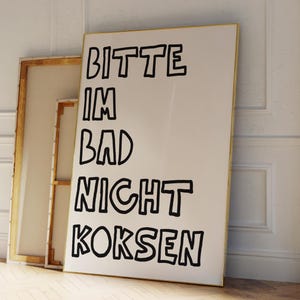 May include: A white canvas with black text that reads "Bitte im Bad nicht koksen". The text is in a bold, outlined font.