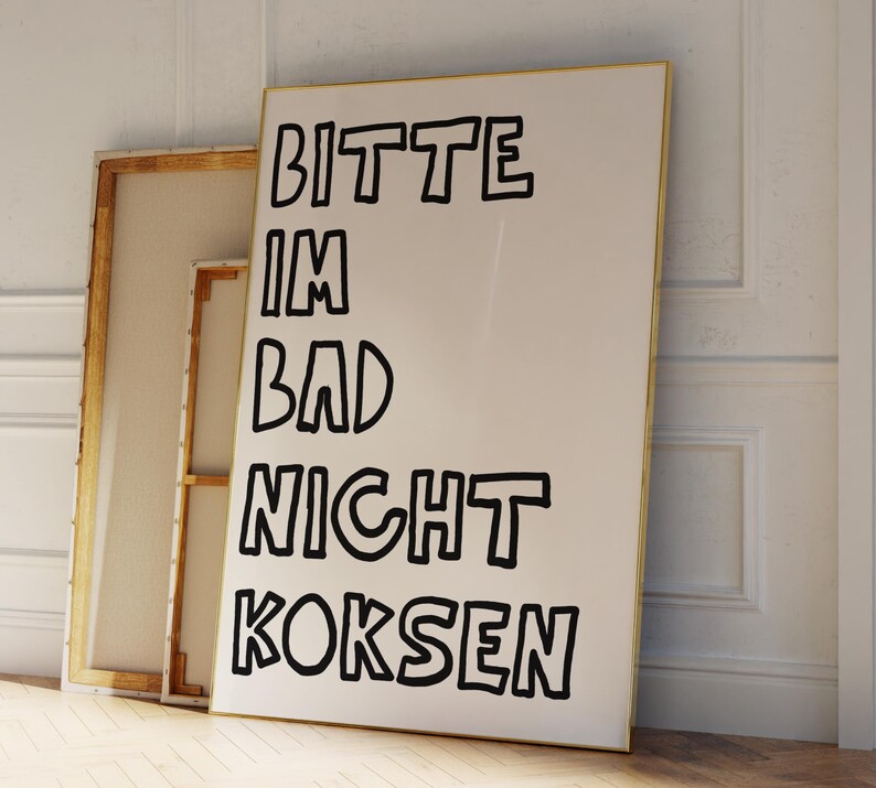 May include: A white canvas with black text that reads "Bitte im Bad nicht koksen". The text is in a bold, outlined font.