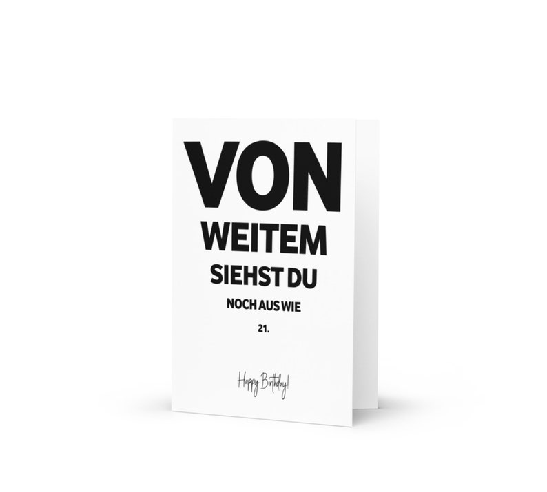 May include: A white card with black text that reads "VON WEITEM SIEHST DU NOCH AUS WIE 21. Happy Birthday!"