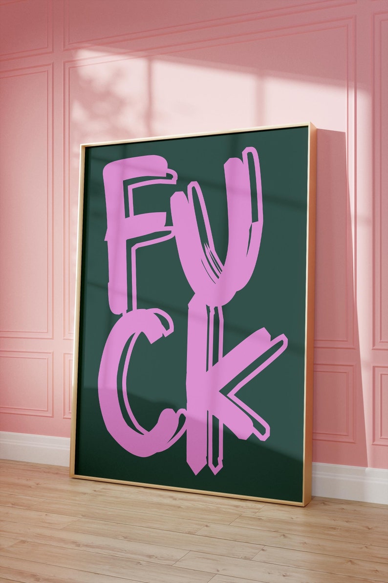 May include: A framed print with a bold, pink "F**K" written in a stylized, brushstroke font on a dark green background.