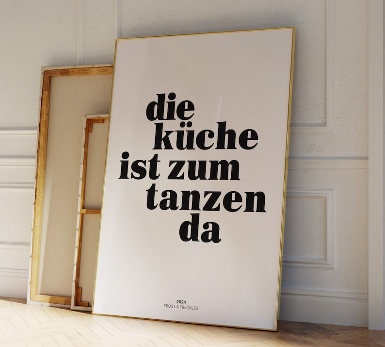 May include: A black and white poster with the text "die k&uuml;che ist zum tanzen da" and the text "2024 FROST & FRECKLES" at the bottom.