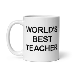 Pode incluir: Caneca de café de cerâmica branca com texto preto que diz "WORLD'S BEST TEACHER".