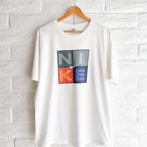 Camiseta Nike Center Swoosh vintage de los años 90 para hombre, talla L, costura simple, fabricada en EE. UU. imagen 1