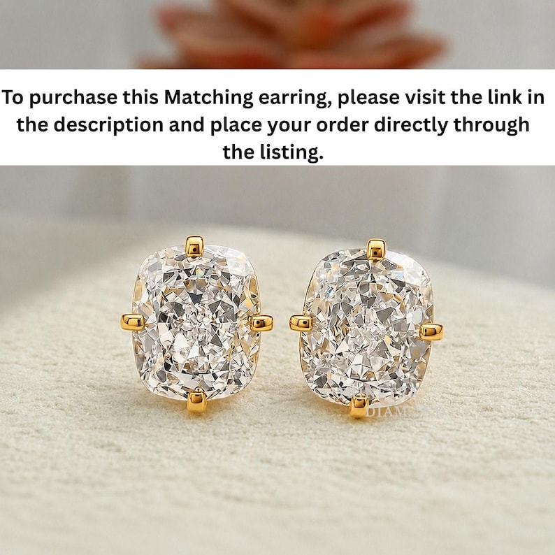 May include: A pair of stud earrings featuring cushion-cut clear stones set in gold-toned metal. Each stone is secured by four prongs at the corners. The text above reads: To purchase this Matching earring, please visit the link in the description and place your order directly through the listing.