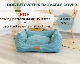 May include: A teal blue dog bed with a removable cover. The bed is made of a soft, textured fabric and has a raised edge. The bed is available in three sizes: small, medium, and large. The image includes the text "DOG BED WITH REMOVABLE COVER", "PDF sewing pattern A4 or US letter + illustrated sewing instructions", and "3 sizes S M L".