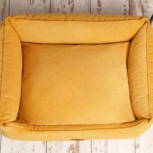 yellow corduroy dog bed with removable and washable cover