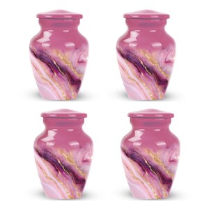 May include: Four small, pink urns with a glossy finish. Each urn features a swirling pattern of purple, white, and gold, with a matching lid. The urns have a classic, rounded shape.