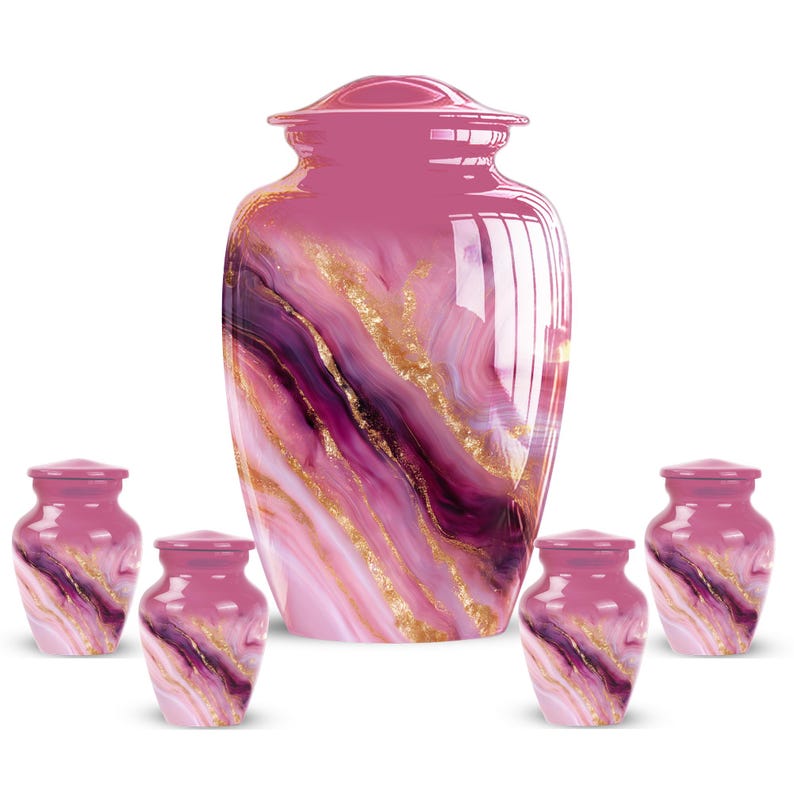 May include: A collection of pink and purple cremation urns with a marbled design and gold accents. The set includes a large urn and five smaller keepsake urns, all with matching lids. The urns are designed with a glossy finish.