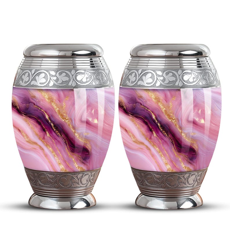 May include: Two urns with a pink, purple, and gold marbled design. The urns have a silver lid and base, with ornate silver bands around the top and bottom. The urns are a decorative and elegant way to store ashes.