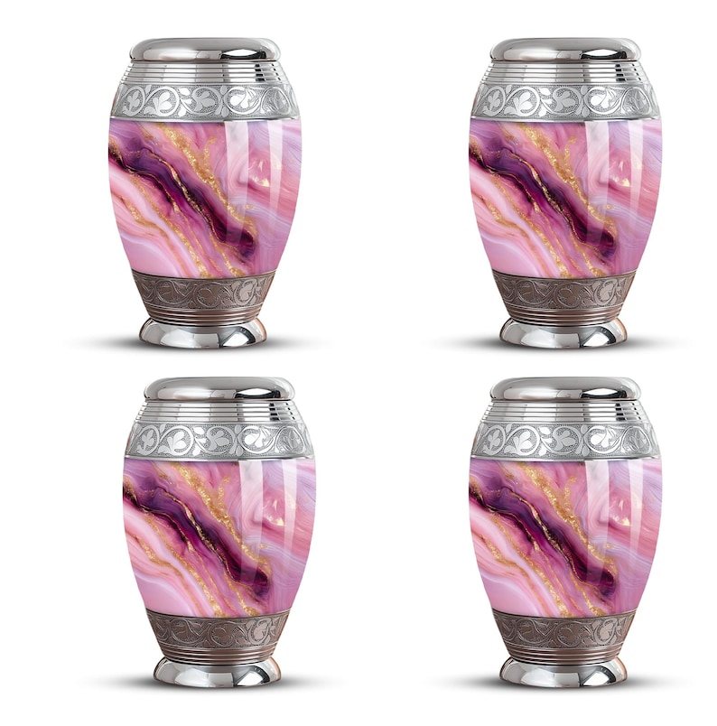 May include: Four urns with a marbled design in shades of pink, purple, and gold. Each urn has a silver-colored lid and base with decorative patterns. The urns are oval-shaped and stand upright against a white background.