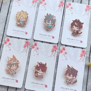 May include: Six enamel pins featuring anime-style characters with animal ears. Each pin is on a white card with a pink floral design and the text "POLARIS NO.III" in black.