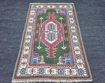 Vintage Green Kazak Rug: Large Handwoven Wool Turkish Carpet (5'10" x 10'2")