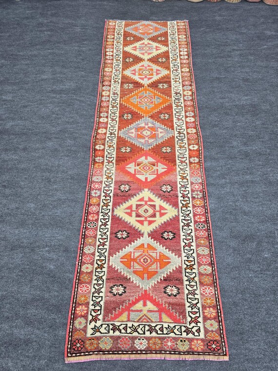 トライバルラグ バルーチ ウール 幾何学模様ブラックレッドベージュ