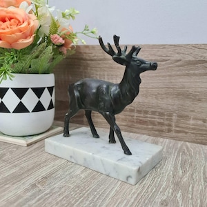 Very old deer figurine of heavy metal on marble 1920 - 1950