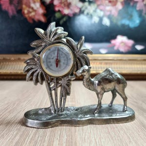 Vintage old Egyptian style metal table thermometer with camel and palm trees