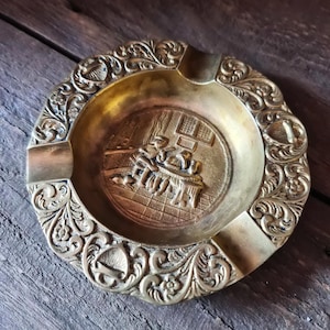 Old classic bronze ashtray with relief designs Holland