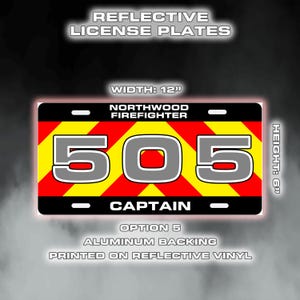 May include: Reflective license plate with a black border, featuring the text "NORTHWOOD FIREFIGHTER" and the number "505" in large grey digits. The plate is 30.5 cm wide and 15.2 cm high, with a red and yellow chevron pattern. The word "CAPTAIN" is at the bottom.