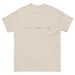 May include: A beige t-shirt with the text "import numpy as np" printed in blue and green.