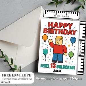 May include: A birthday card with the text "HAPPY BIRTHDAY" in red, featuring a cartoon character and balloons. The card reads "LEVEL 13 UNLOCKED!" and includes the name "JACK". The card measures 5.9 inches wide and 8.2 inches tall.